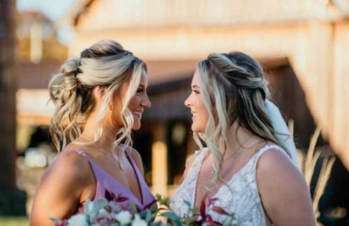 Bride and maid of honor posing together